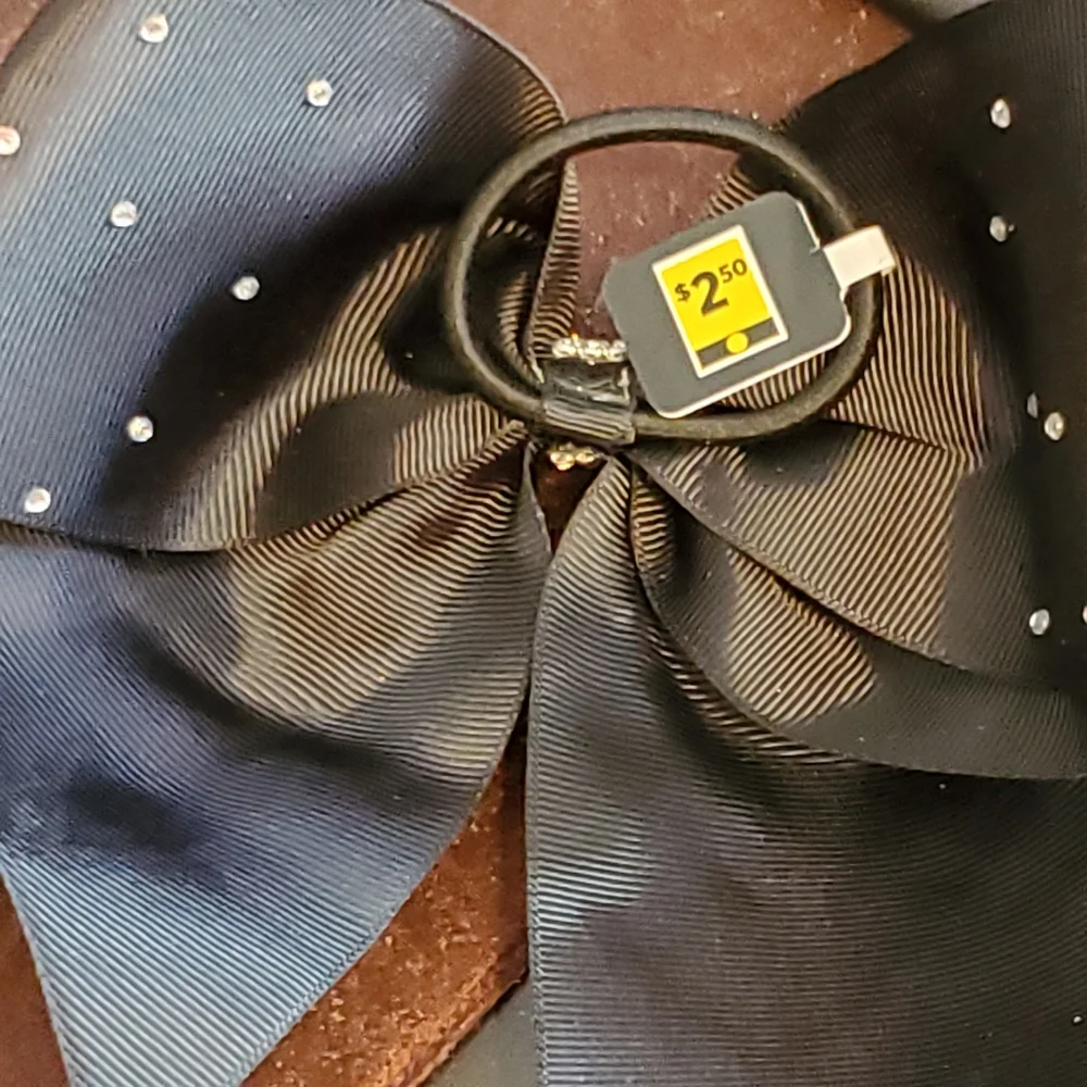 Black ponytail holder with bow and clear rhinestones and studs